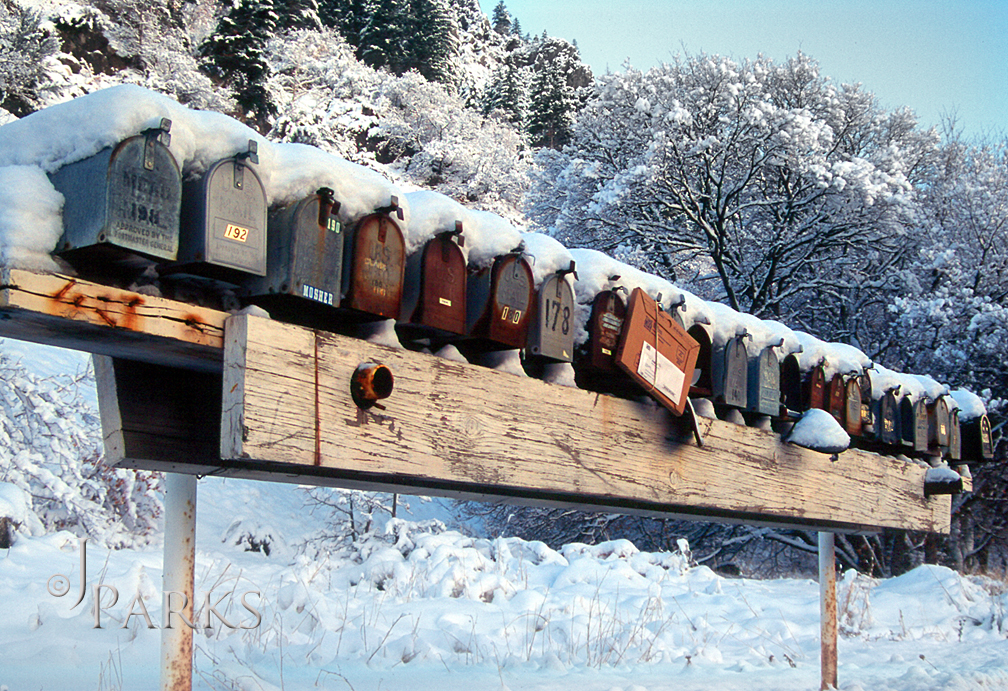 Rural route mail box stand in winter dress